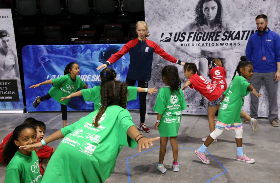 Olympic athlete Bradie Tennell of U.S. Figure Skating works on balance with Lied Memorial Boys ...