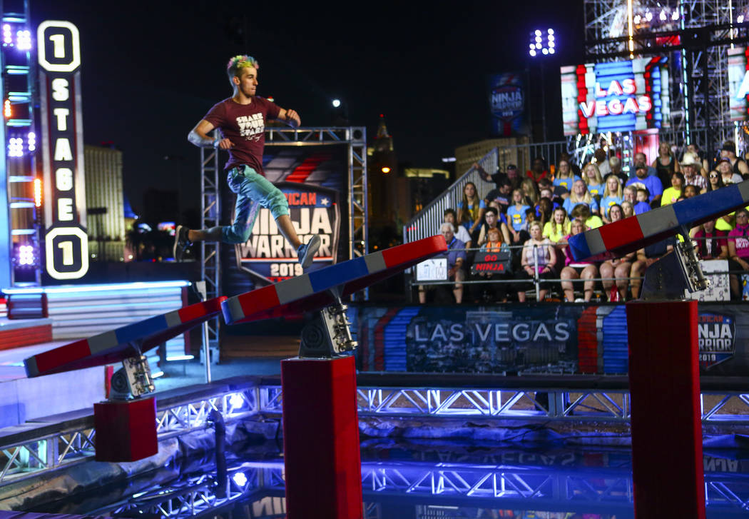 Former American Ninja Warrior competitor Austin Gray attempts the first obstacle from stage one ...