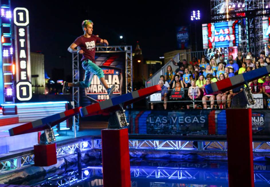 Former American Ninja Warrior competitor Austin Gray attempts the first obstacle from stage one ...