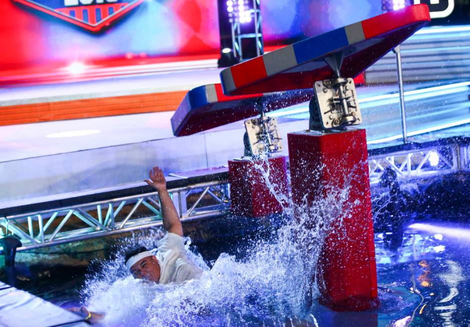 Adrian Hernandez of Hot 97.5 falls to the water while attempting the first obstacle from stage ...