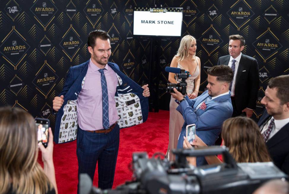 Golden Knights Mark Stone shows off his new suit on the red carpet before the start of the NHL ...