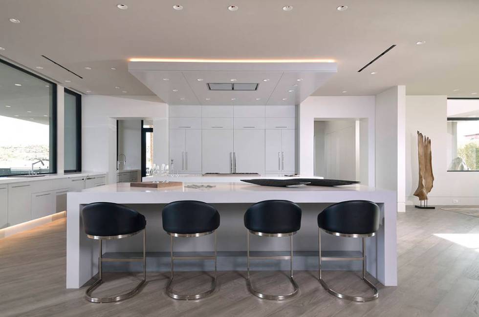 Water’s Edge’s European-inspired kitchen features a double island, professional-grade appli ...