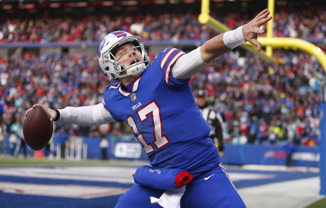 FILE - In this Dec. 30, 2018, file photo, Buffalo Bills quarterback Josh Allen celebrates his t ...