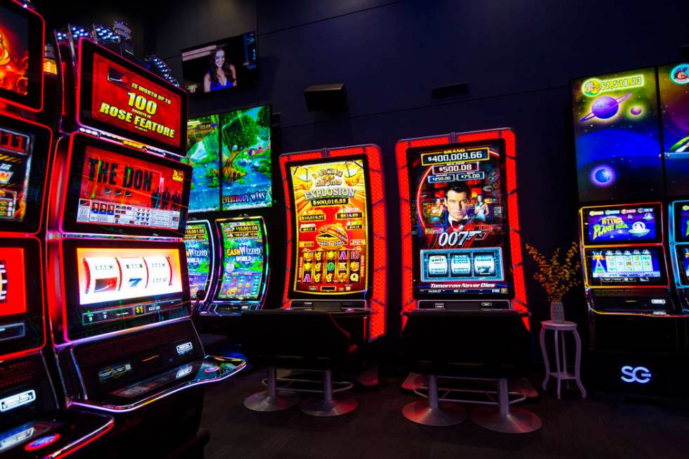 Slot cabinets with a curved 75" display and 4K resolution at the Scientific Games showroom ...