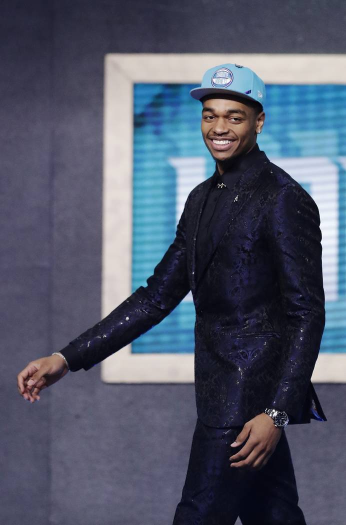 Kentucky's P.J. Washington smiles after the Charlotte Hornets selected him as the 12th pick ov ...