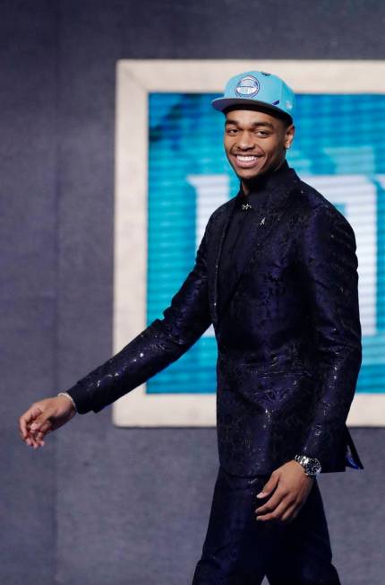 Kentucky's P.J. Washington smiles after the Charlotte Hornets selected him as the 12th pick ov ...