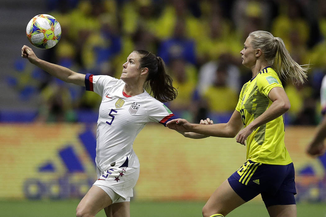 United States' Kelley O Hara looks to kick the ball clear of Sweden's Fridolina Rolfo, right, d ...