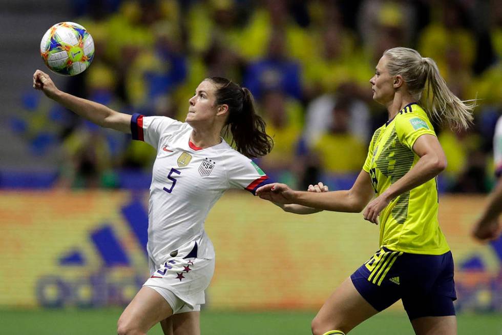 United States' Kelley O Hara looks to kick the ball clear of Sweden's Fridolina Rolfo, right, d ...