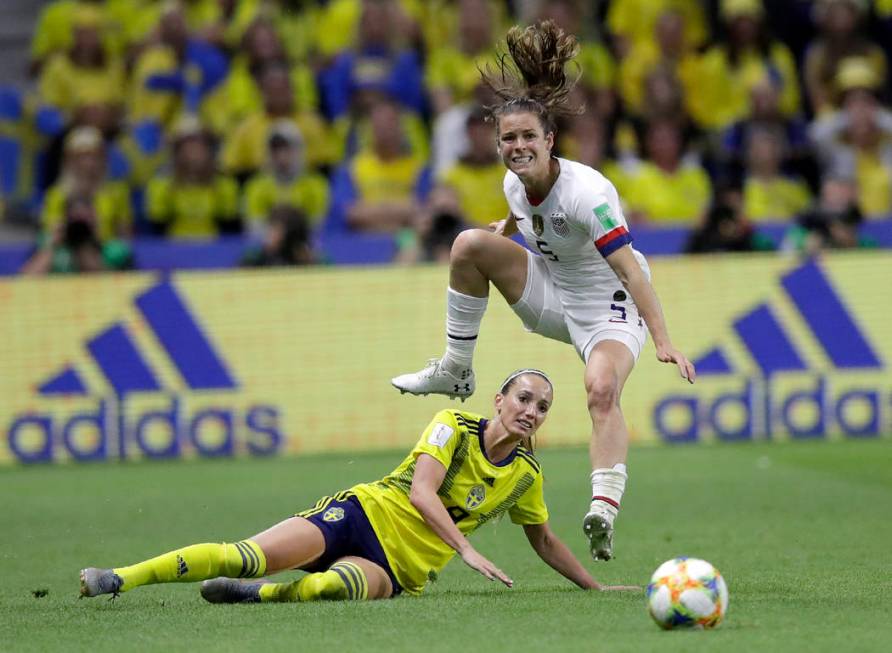 United States' Kelley O Hara leaps over Sweden's Kosovare Asllani during the Women's World Cup ...