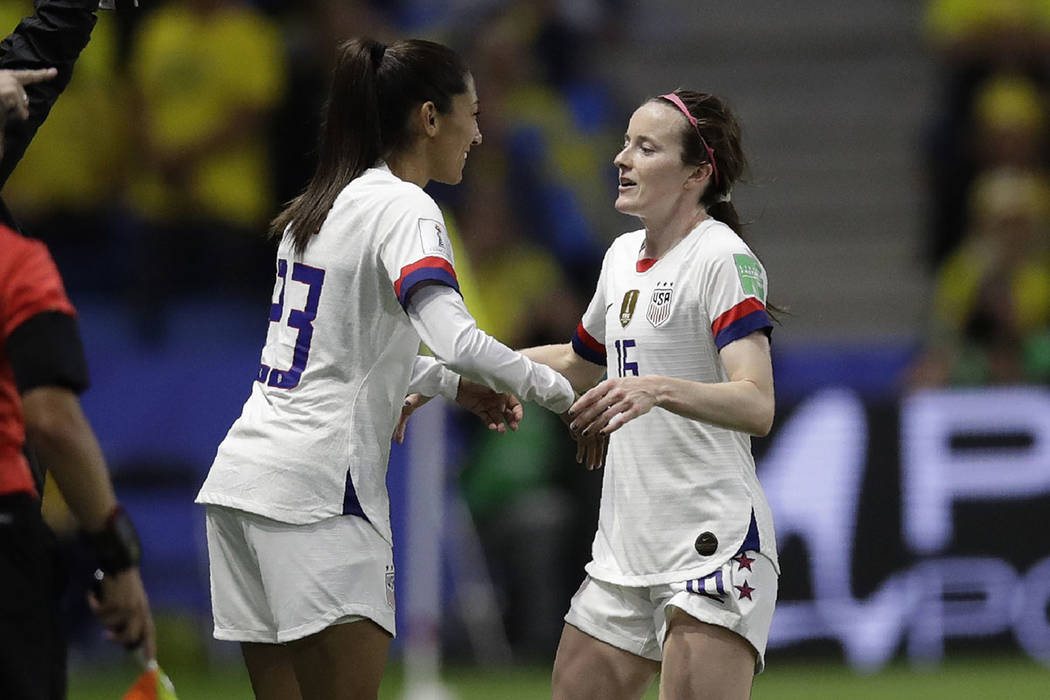 United States' Rose Lavelle, right, is substituted by teammate Christen Press during the Women' ...