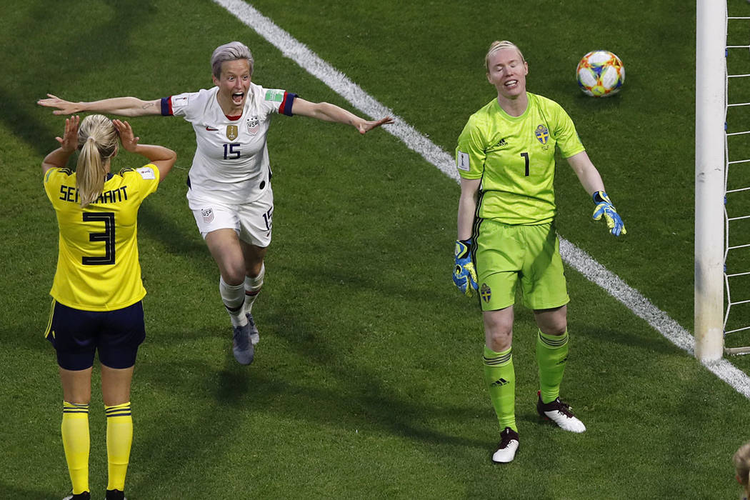 United States' Megan Rapinoe, centre, celebrates after United States' Tobin Heath scored her si ...