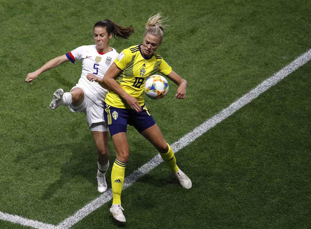 United States' Kelley O Hara, left, and Sweden's Fridolina Rolfo challenge for the ball during ...