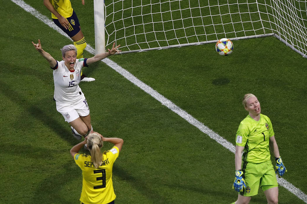 United States' Megan Rapinoe, left, celebrates after United States' Tobin Heath scored her side ...