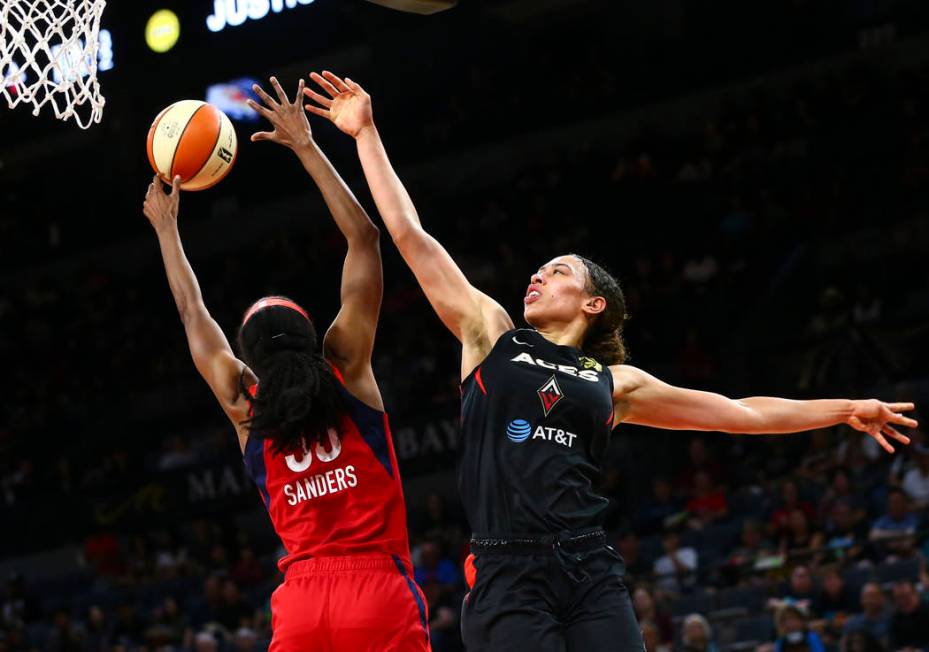 Washington Mystics forward LaToya Sanders (30) blocks a shot from Las Vegas Aces forward Dearic ...