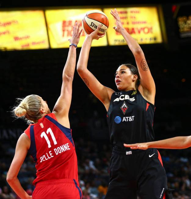 Las Vegas Aces center Liz Cambage (8) shoots over Washington Mystics forward Elena Delle Donne ...