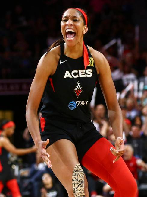 Las Vegas Aces center A'ja Wilson (22) reacts after drawing a foul and scoring against the Wash ...