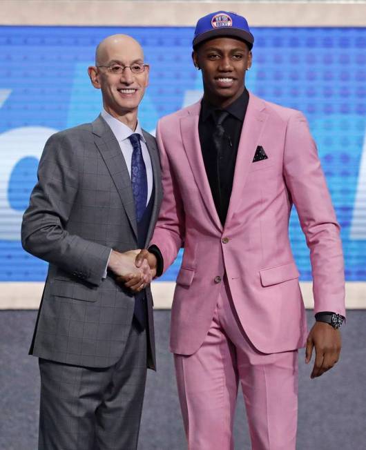 Duke's RJ Barrett poses for photographs with NBA Commissioner Adam Silver after being selected ...
