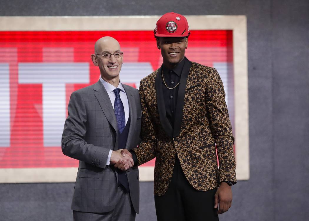 NBA Commissioner Adam Silver poses for photographs with Duke's Cam Reddish after the Atlanta Ha ...