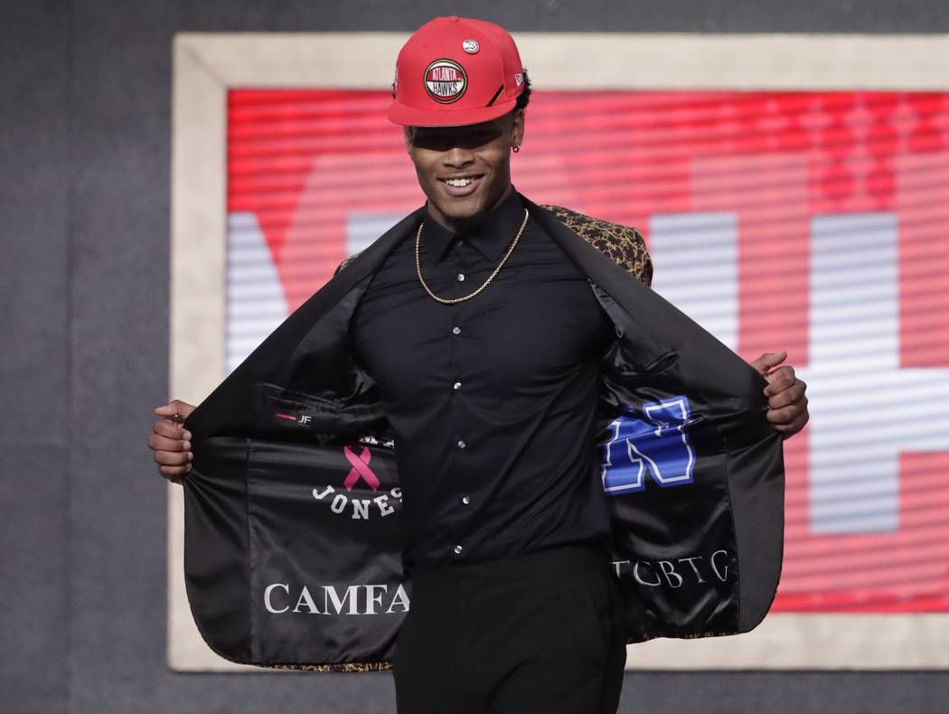 Duke's Cam Reddish shows off his jacket after the Atlanta Hawks selected him as the 10th overal ...