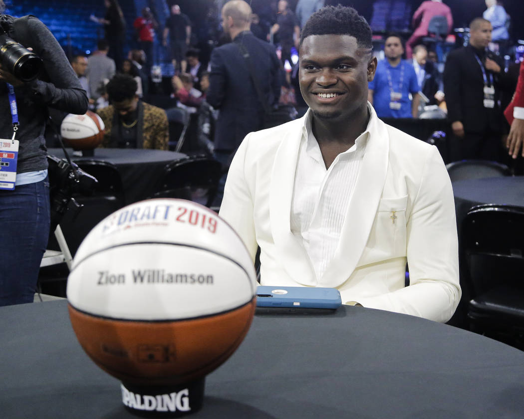Zion Williamson, of Duke, smiles before the NBA basketball draft Thursday, June 20, 2019, in Ne ...