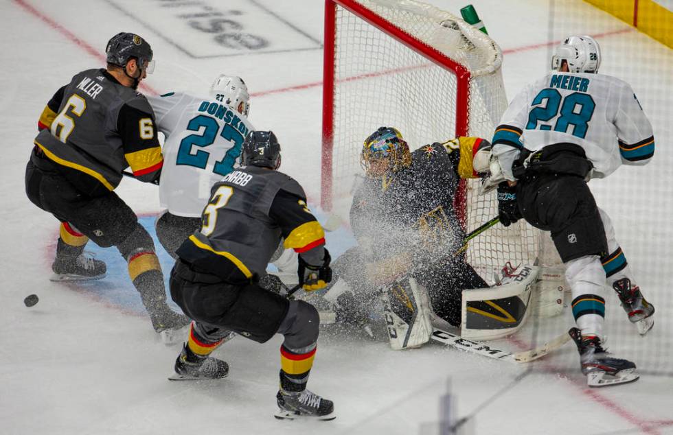 Golden Knights goaltender Marc-Andre Fleury (29) is covered in ice shavings fromSan Jose Sharks ...