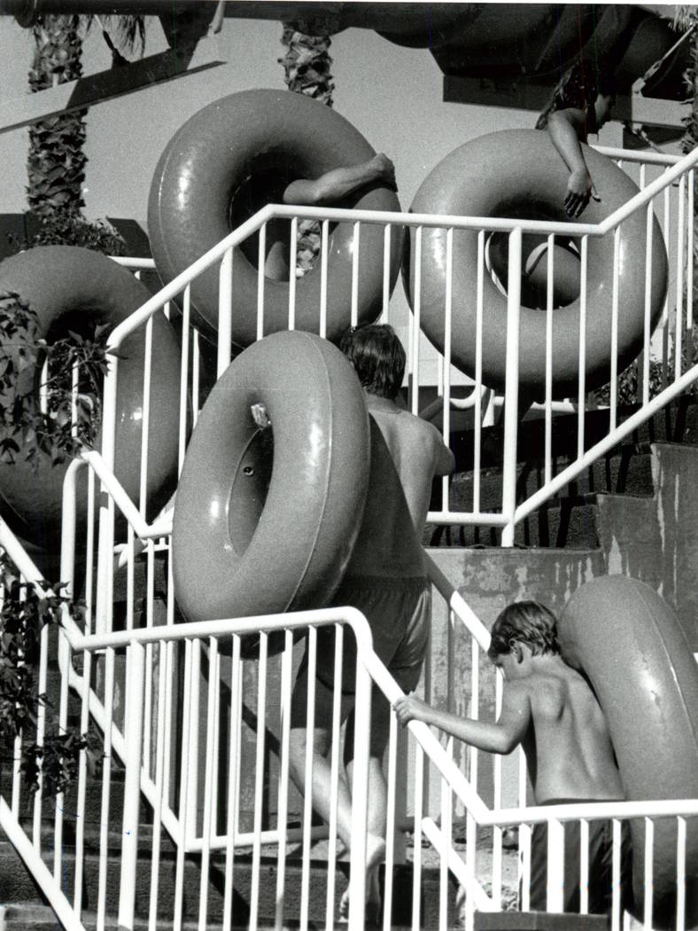 Riders carry innertubes to the top of a ride at Wet 'n Wild on Las Vegas Boulevard. (Dan Euoff/ ...