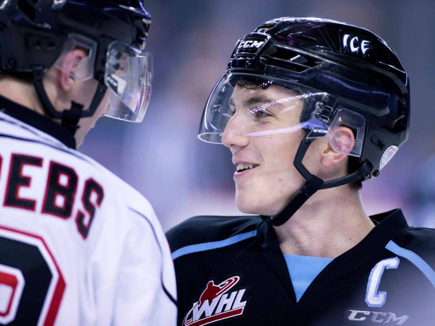 WHL (Western Hockey League) profile photo on Kootenay Ice player Peyton Krebs, right, chatting ...