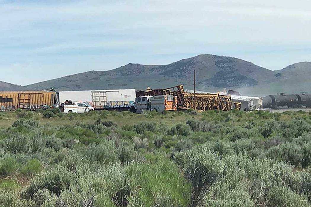 A freight train carrying military munitions, headed for the Hawthorne Army Depot in Nevada, der ...