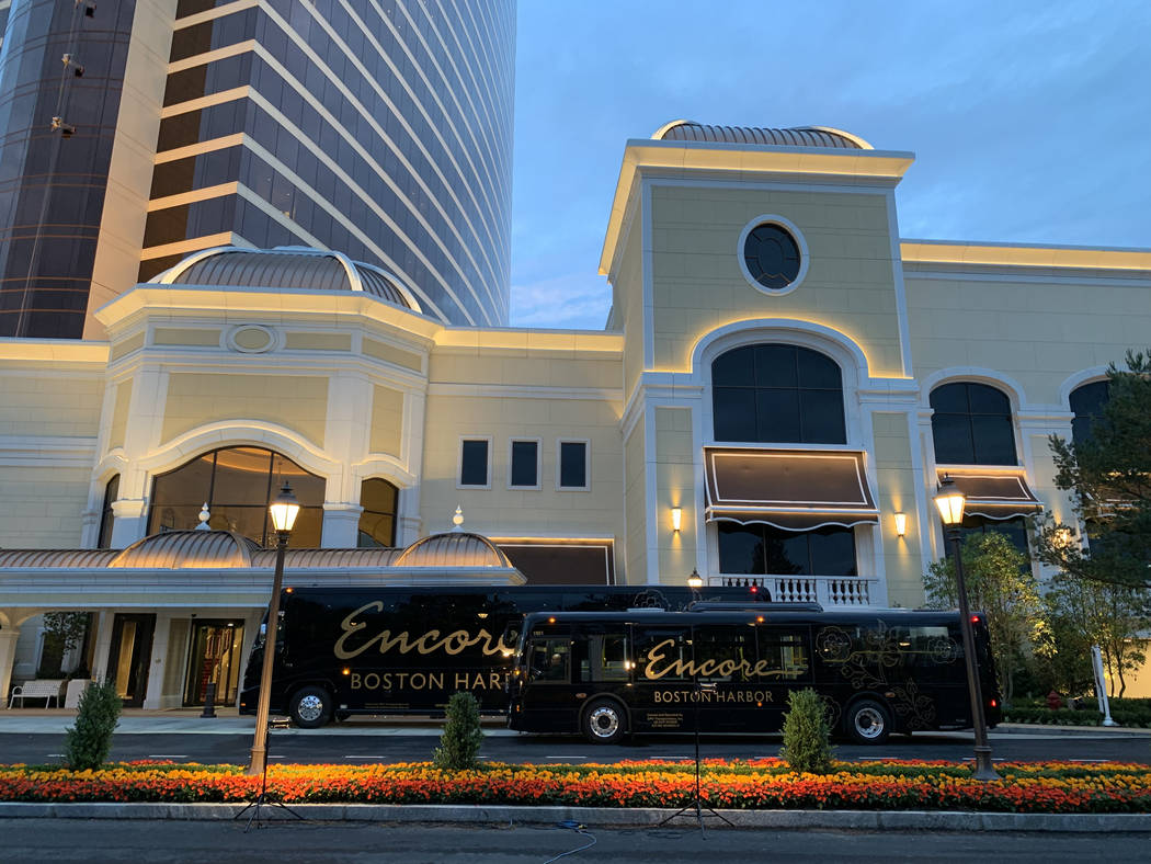 A luxury motor coach and shuttle bus at Encore Boston Harbor in Everett, Mass., Friday, June 21 ...