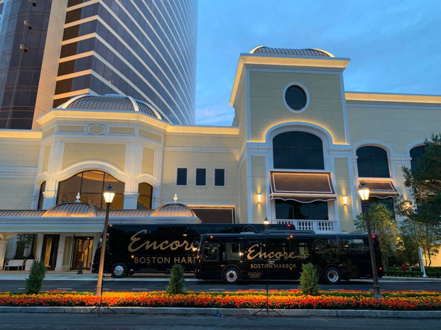 A luxury motor coach and shuttle bus at Encore Boston Harbor in Everett, Mass., Friday, June 21 ...