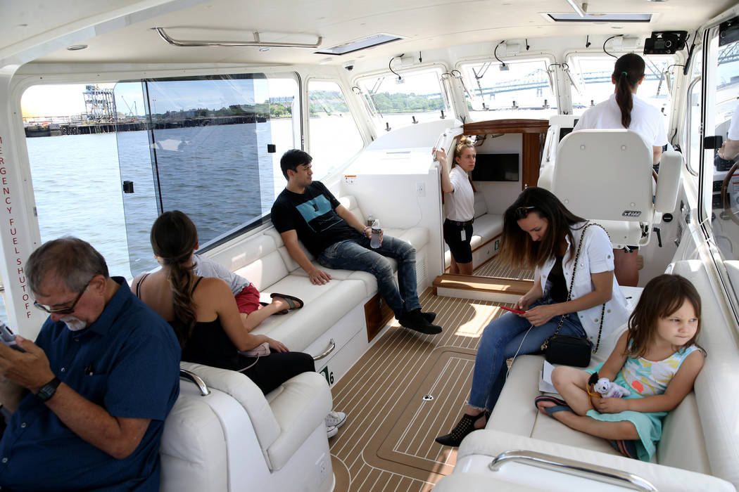 Captain Jacqueline Saba pilots a luxury harbor shuttle on the Mystic River near Encore Boston H ...