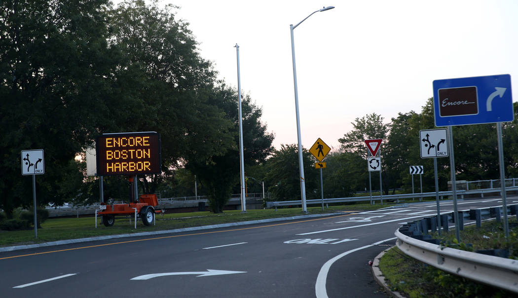 Signs direct traffic for the opening of the $2.6 billion Encore Boston Harbor in Everett, Mass. ...