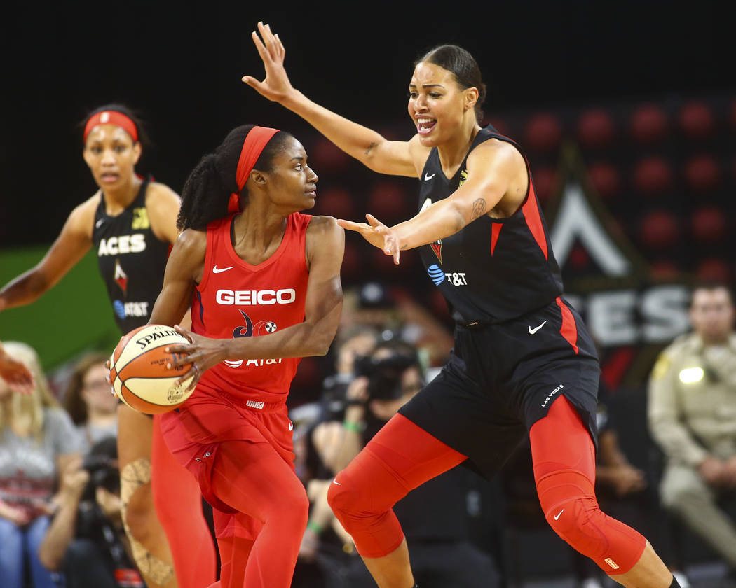 Las Vegas Aces center Liz Cambage (8) guards Washington Mystics forward LaToya Sanders (30) dur ...