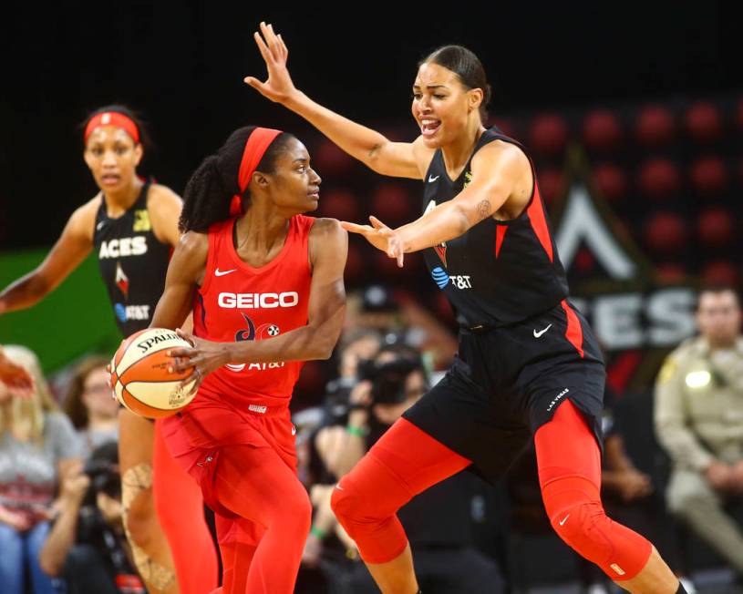 Las Vegas Aces center Liz Cambage (8) guards Washington Mystics forward LaToya Sanders (30) dur ...