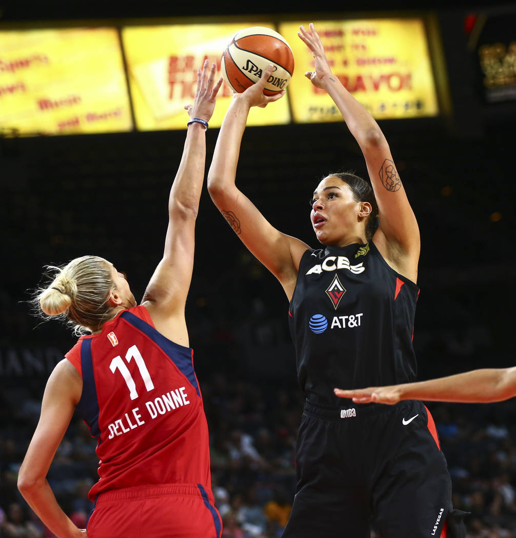 Las Vegas Aces center Liz Cambage (8) shoots over Washington Mystics forward Elena Delle Donne ...