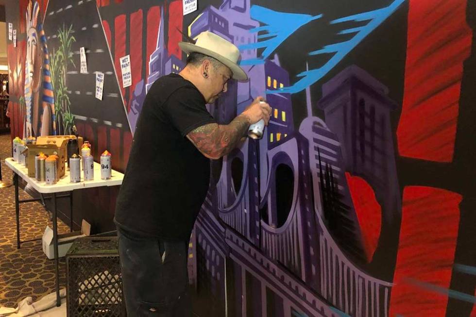 Jay James, aka Tiki Jay One, works on the "R.U.N" art installation at Luxor on Friday, June 21, ...