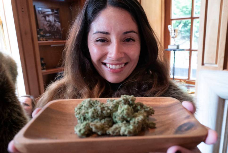 Christy Banda, a representative for the Jack Herer cannabis company, displays their latest mari ...