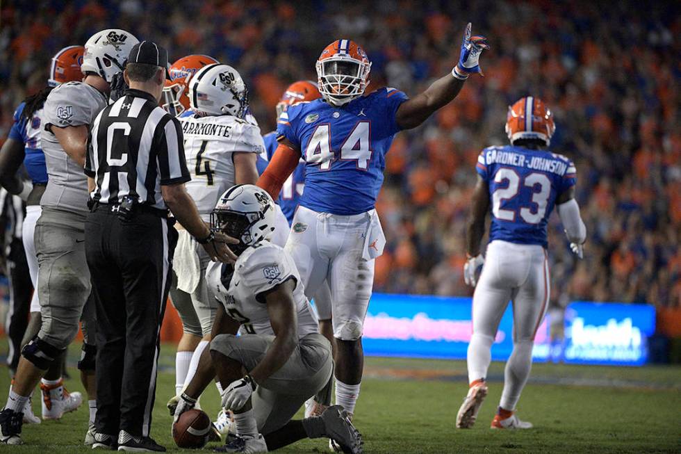 Florida linebacker Rayshad Jackson (44) celebrates after tackling Charleston Southern running b ...