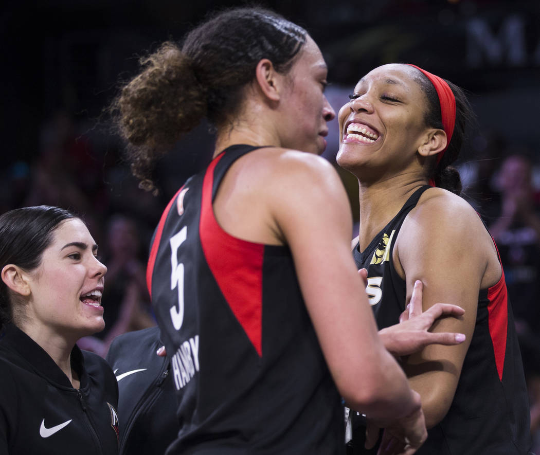 Las Vegas Aces center A'ja Wilson (22) celebrates with Las Vegas Aces forward Dearica Hamby (5) ...