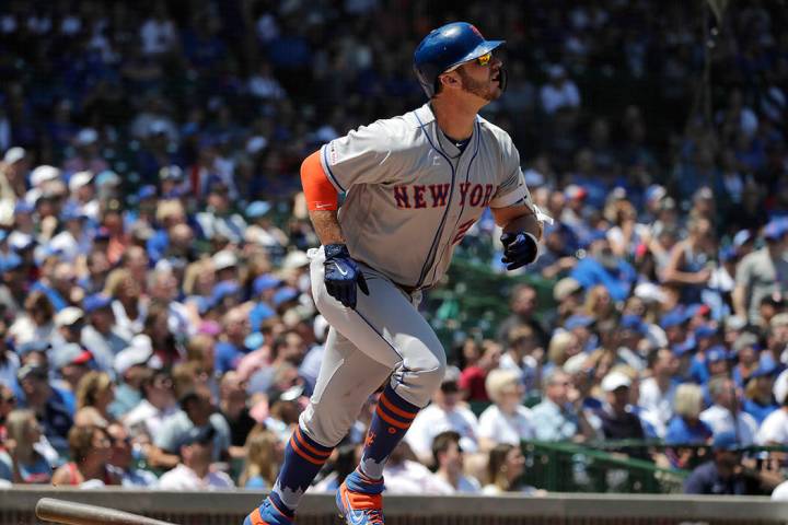 New York Mets' Pete Alonso watches after hitting a solo home run against the Chicago Cubs durin ...