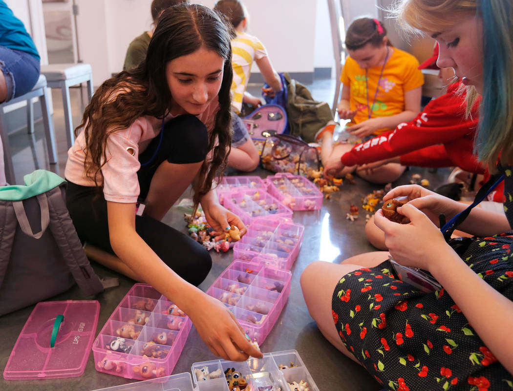 Eva Tonella, 12, of San Francisco, left, and Megan Diesing, 13, of Portland, Ore., check Little ...