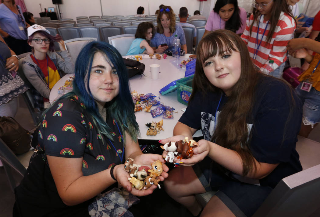 Laila Pittman, 11, of Illinois, left, and Elyse Despain, 12, of St. George, Utah show their Lit ...