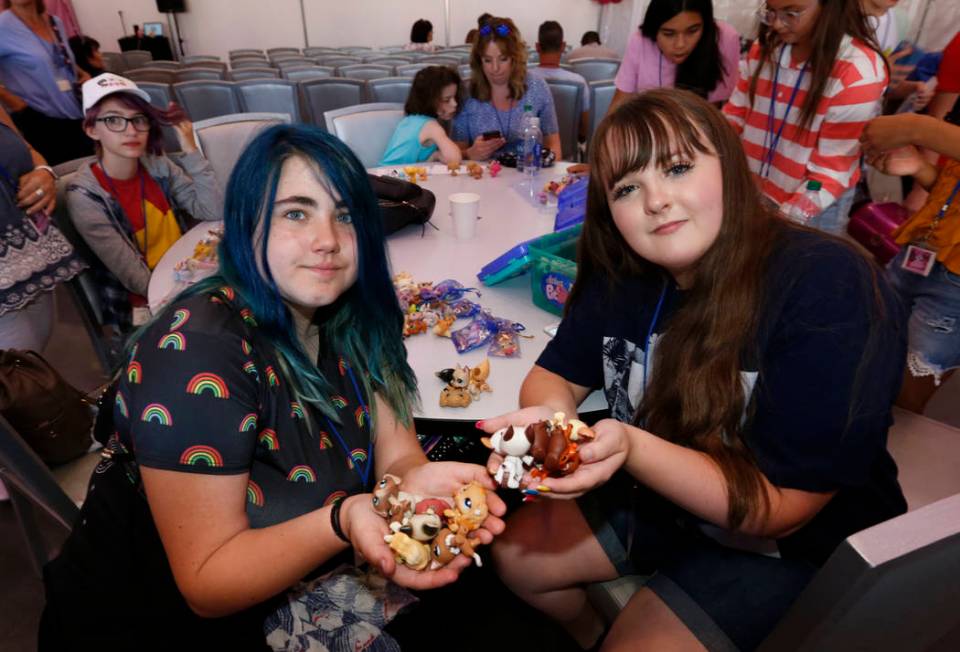 Laila Pittman, 11, of Illinois, left, and Elyse Despain, 12, of St. George, Utah show their Lit ...