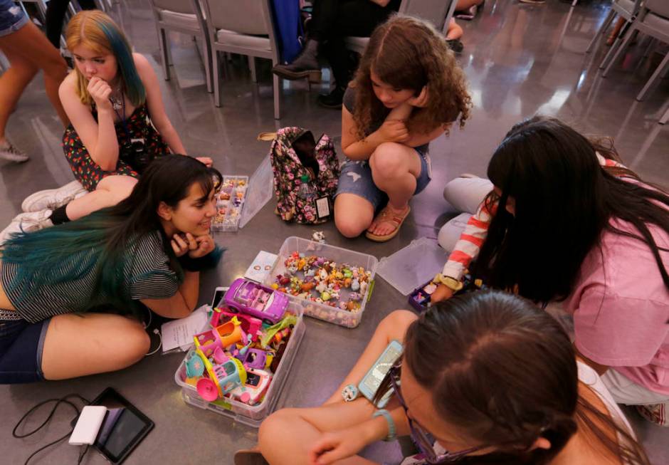 Angelica Sanchez, 17, of Los Angeles, foreground left, shows her Littlest Pet Shop collection t ...