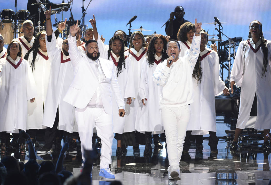 DJ Khaled, left, and John Legend perform during a tribute to late rapper Nipsey Hussle at the B ...