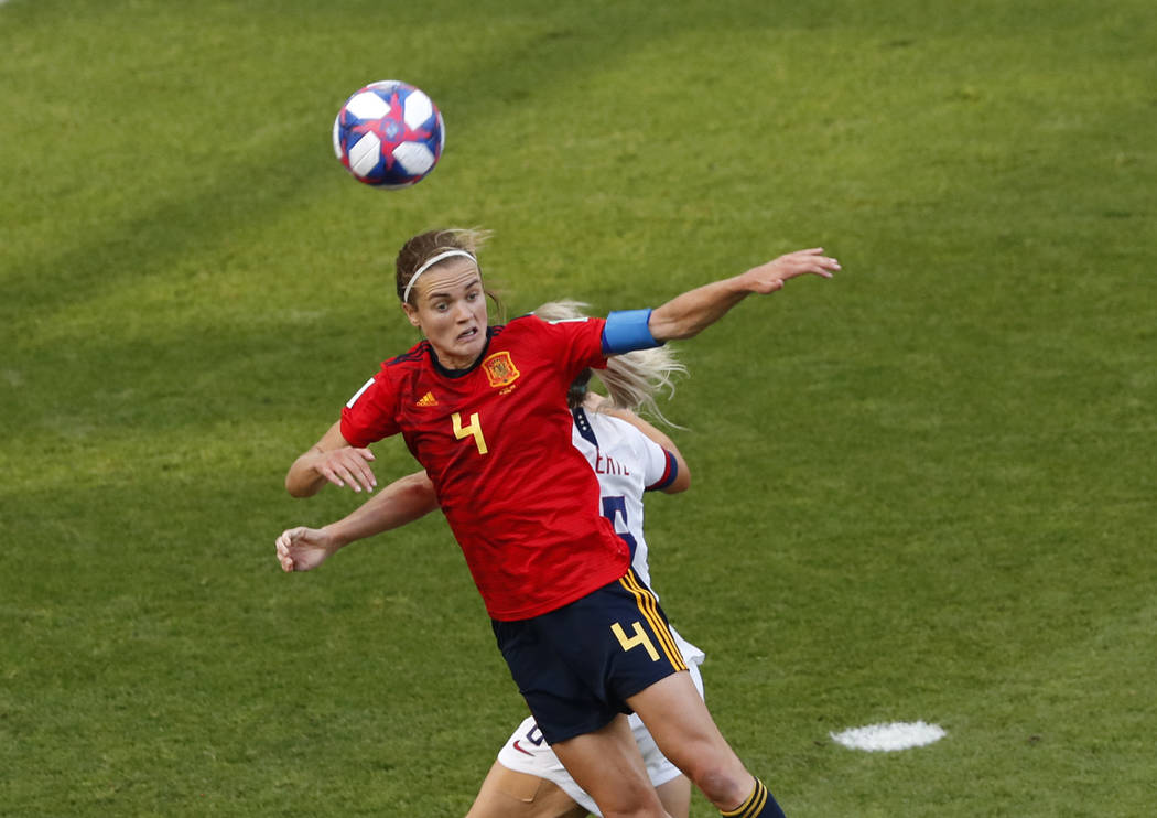 Spain's Irene Paredes, front, duels for the ball with United States' Julie Ertz during the Wome ...