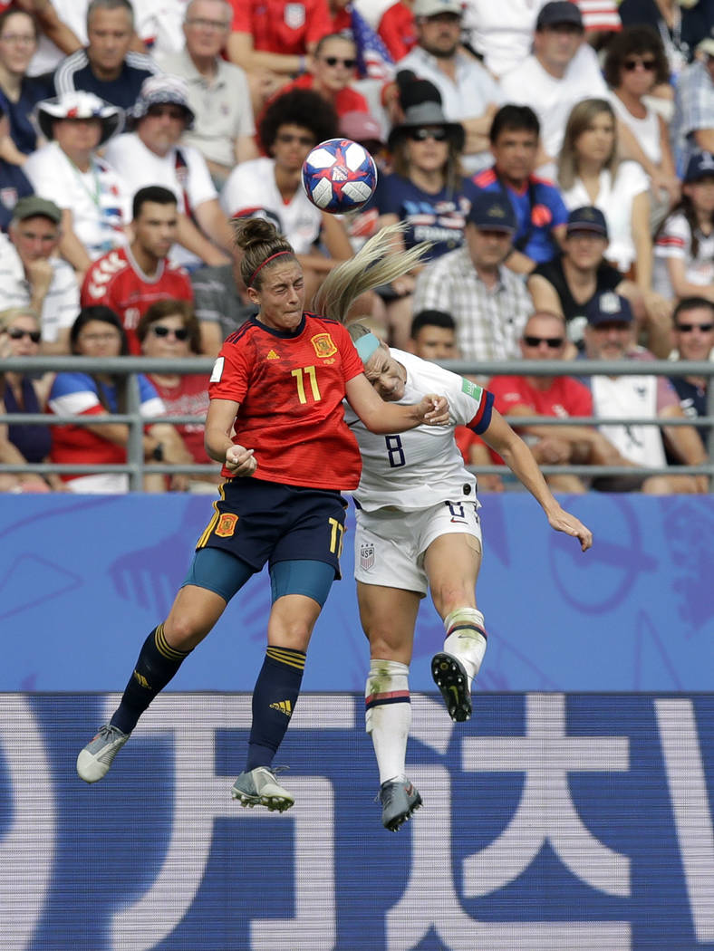 Spain's Alexia Putellas, left, challenges for the ball with United States'Julie Ertz during the ...