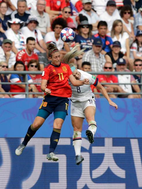 Spain's Alexia Putellas, left, challenges for the ball with United States'Julie Ertz during the ...