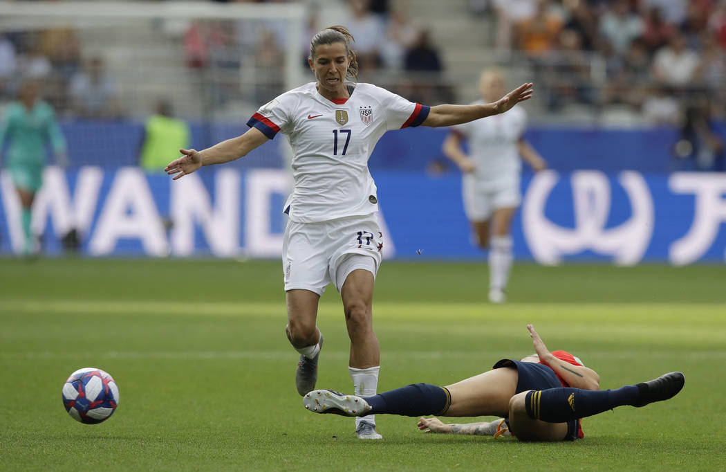 United States' Tobin Heath, left, is challenged for the ball by Spain's Maria Leon during the W ...