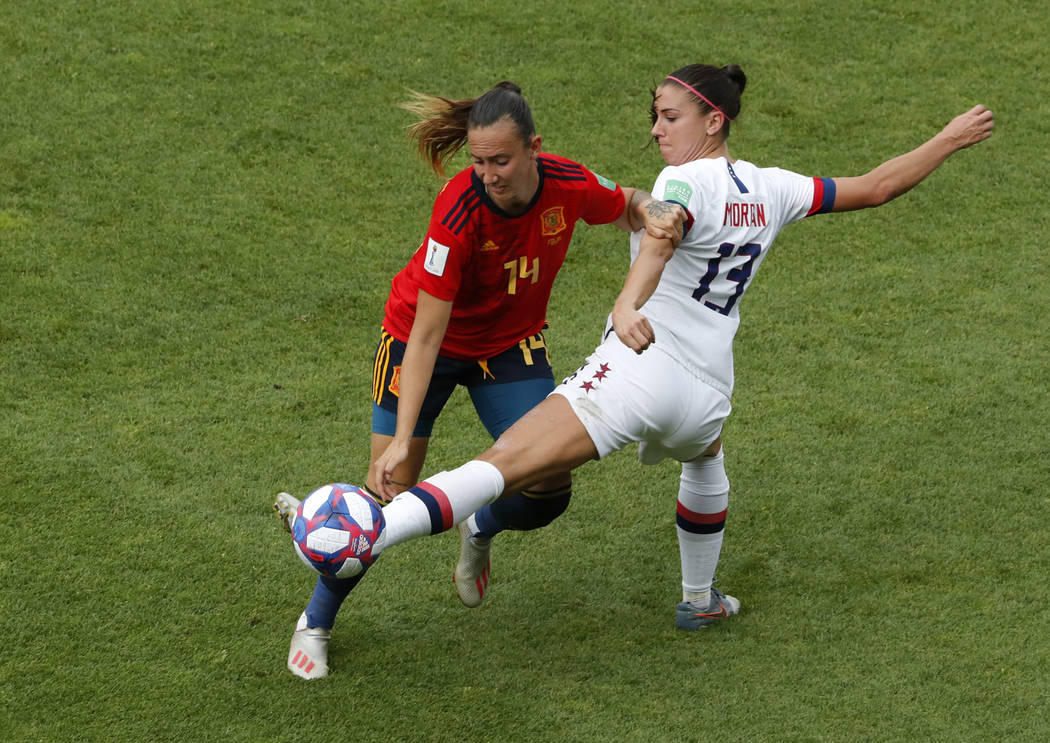 United States' Alex Morgan, right, duels for the ball with Spain's Virginia Torrecilla during t ...